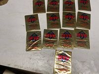 Front view of thirteen gold McDonald’s MVP card packs