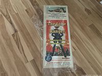 Front view of The Lone Ranger movie poster inside protective plastic