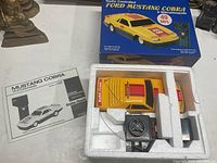 Box top showing branding and scale RC car image
