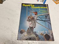 Front cover showing basketball national championship headline