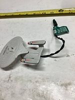 Top view of Star Trek U.S.S. Enterprise ornament with attached wire and plug