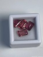 four rectangular pink tourmalines in white box