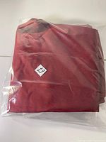 Jeans folded in clear plastic bag