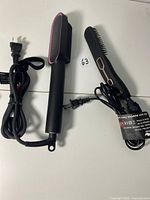 Both hair styling brushes with cords visible