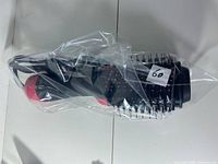 Brush sealed in plastic wrap