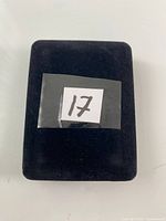 Closed black ring box top view