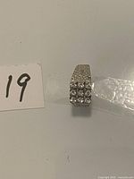 Top view showing 3×3 clear stone cluster