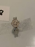 front view of ring showing cluster setting