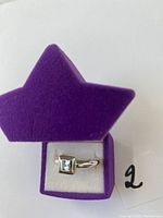 Ring in star-shaped box, angled view