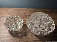 Top and side view of both glass flower frogs