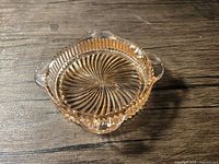Overall view of square pink Depression glass ashtray