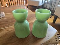 Two jadeite double egg cups shown upside down highlighting base and color