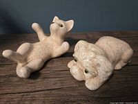 Cat and dog ceramic figurines top view
