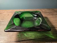 Top view showing square shape, green glass, concave center