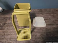 Container, strainer handle, and lid overview