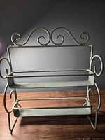 Front angled view showing rack structure and scroll design