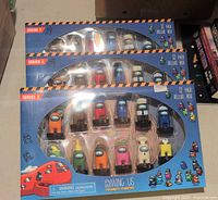 Three sealed Series 2 12-pack boxes displayed
