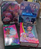 Front view of all four boxed toys