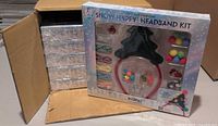 Front view of one sealed headband kit showing contents and 58-piece label