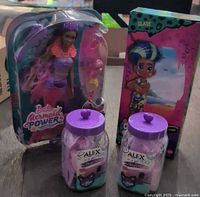Group shot of Barbie Mermaid Power doll, Cave Club Slate doll, and two Alex Spa jars, all sealed.