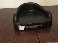 front view of black rubber booster seat