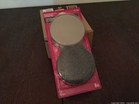 Front view of sealed Everbilt slider pad pack