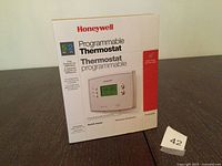 Front of unopened Honeywell programmable thermostat box