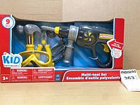 Front of sealed Kid Connection 9-piece multi-tool set showing drill, hammer, goggles, screws in packaging