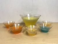 Set of six colored glass bowls displayed front view