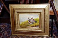 Framed original oil painting of three quail birds outdoors on grassy terrain, with visible signature.