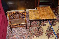 Wicker style magazine rack and two nesting tables placed on a patterned rug by wooden floor