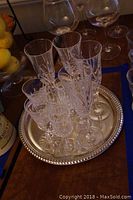 Crystal glasses set on silver plated tray including Waterford Lismore sherry glasses and Gorham Lady Madison champagne flutes