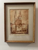 Full view of framed etching showing artwork, mat and frame