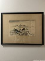 Full view of framed etching on wall