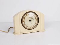 Front view of Smiths Sectric bakelite mantel clock showing dial and casing