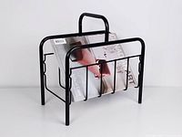 Front view with a magazine inside the black metal holder