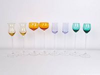 Front view of all eight coloured liqueur glasses lined up
