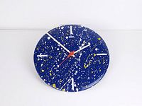 Front view of blue splatter Umbra wall clock