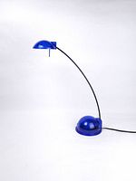Full view of blue translucent halogen desk lamp showing curved stem, base and shade