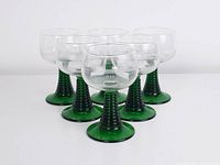 Six green-stemmed glasses front view