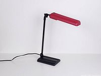 Full view of Lival Poco lamp showing red shade, black arm and base