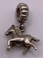 Front view of Pandora horse dangle charm