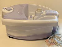 Side view of the Dr. Scholl's foot bath showing basin shape, power cord