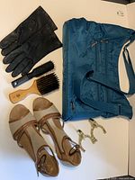 Lot overview showing bag, gloves, hairbrush, sandals, hooks