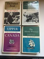 Front covers of all four Canadian Centenary Series volumes