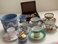 Group shot showing all ceramic pieces, planter, jar, jewelry box with spools