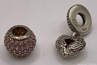 Both charms side by side showing overall form