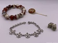 Group shot showing all four jewelry pieces