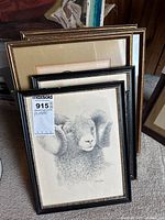 Stack of five framed prints, ram print foremost