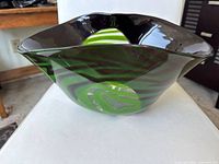 Side view showing green and black swirl pattern and form